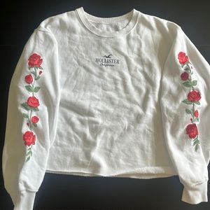 Hollister crew neck white with roses in sleeves